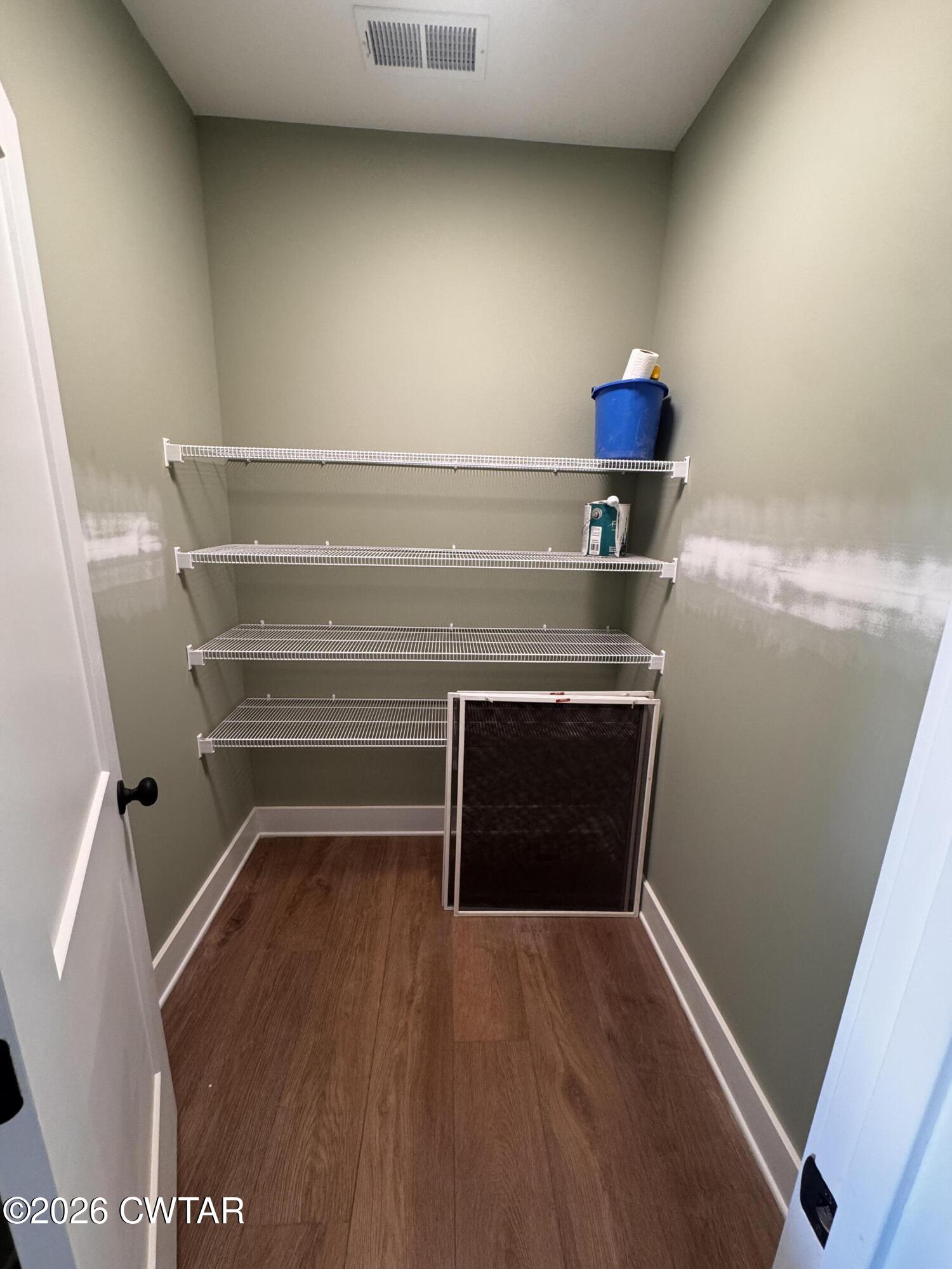 24 Tea Berry Cove Jackson, TN 38305 - Photo 16 of 16 a view of storage and utility room with wooden floor