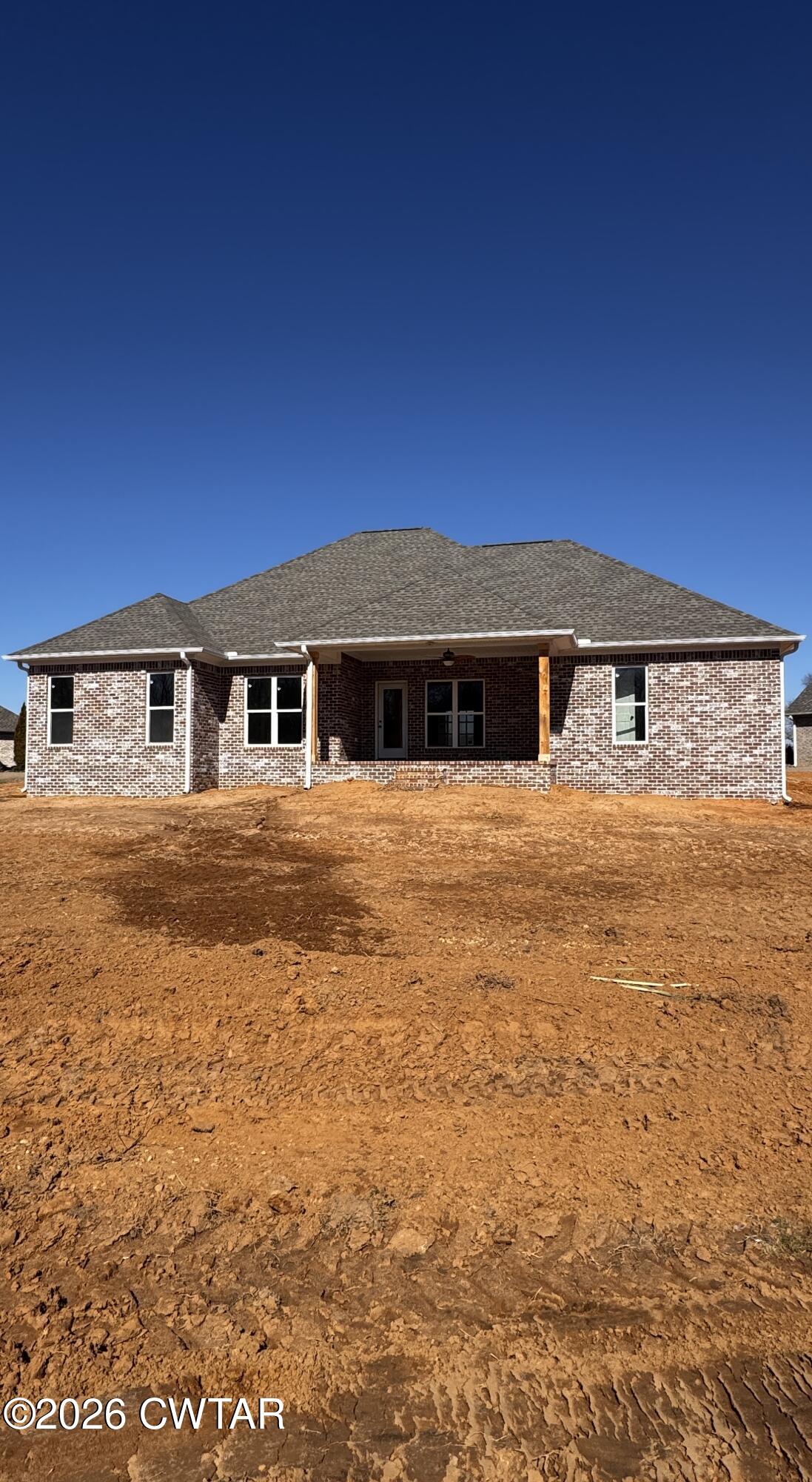 24 Tea Berry Cove Jackson, TN 38305 - Photo 2 of 16 a front view of a house with a yard