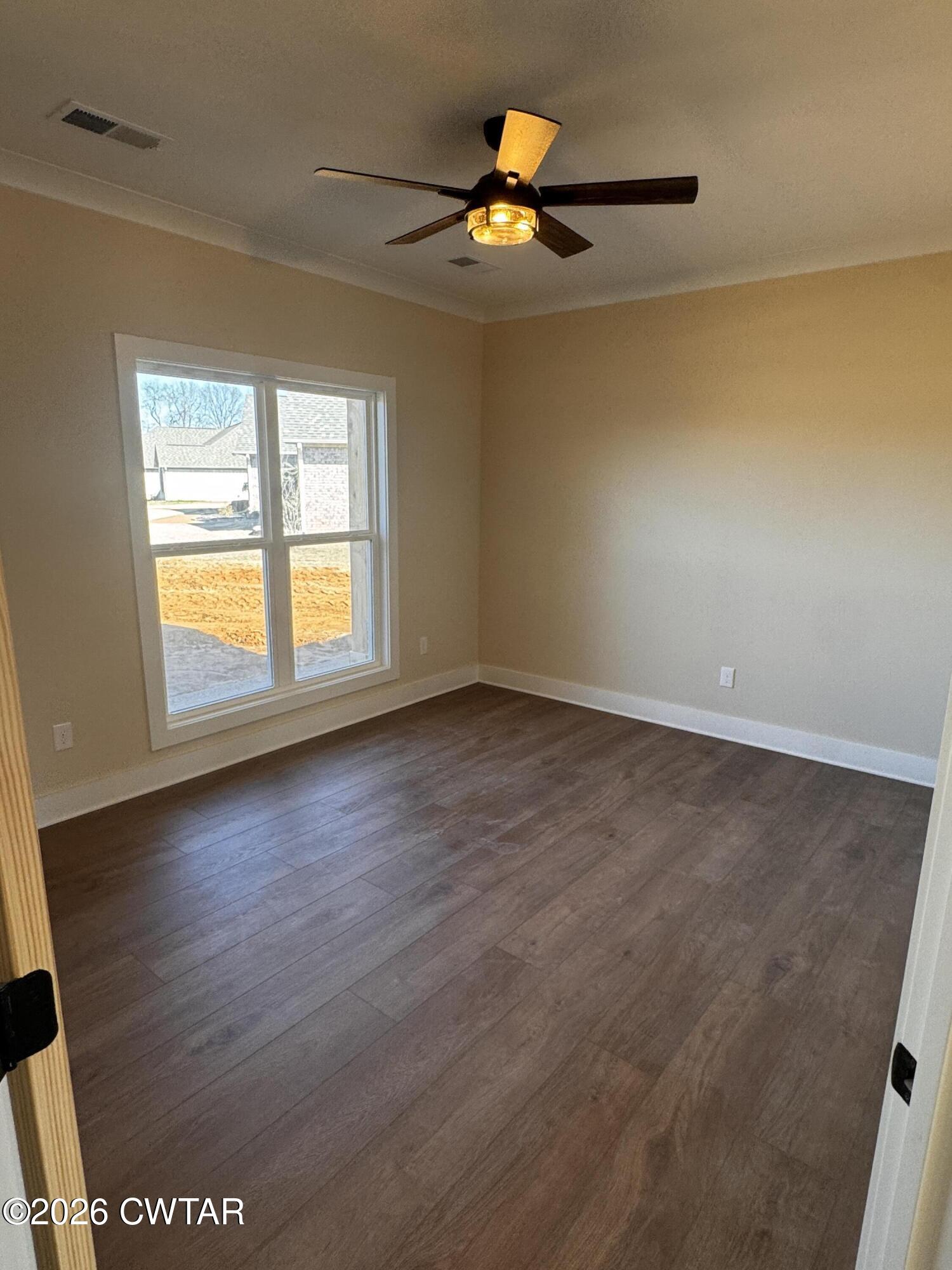 24 Tea Berry Cove Jackson, TN 38305 - Photo 7 of 16 an empty room with a window