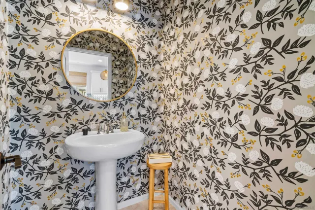 a bathroom with a sink and mirror