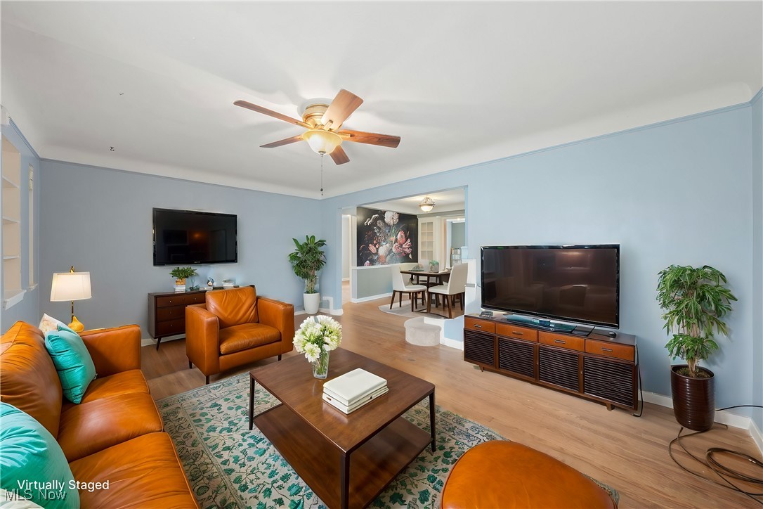 4146 Wyncote Road South Euclid, OH 44121 - Photo 4 of 20 Living area featuring baseboards, wood finished floors, and a ceiling fan VIRTUALLY STAGED