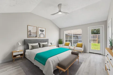 a bedroom with a bed and a couch