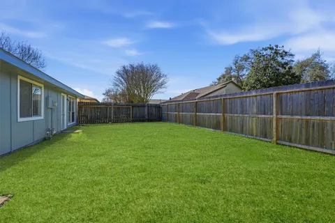 a view of a backyard with a cabin