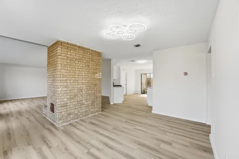 a view of livingroom with hardwood floor and a ceiling fan