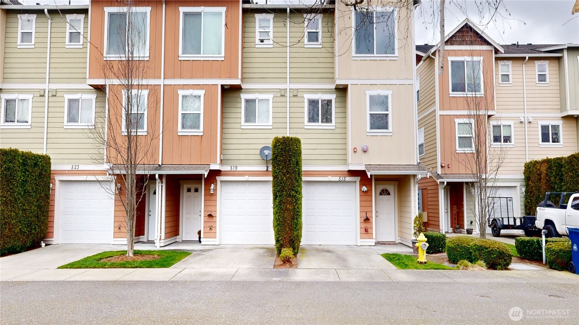 a front view of a building with small garden