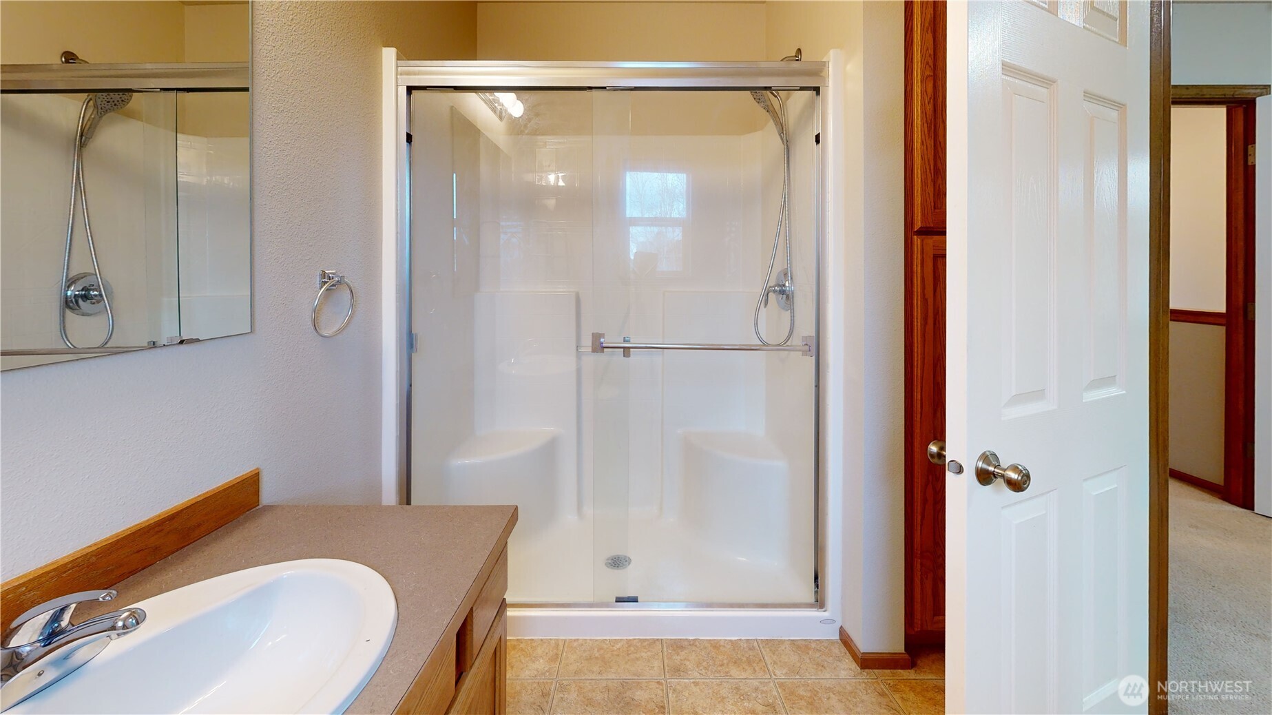 515 Neff Circle Burlington, WA 98233 - Photo 17 of 23 a bathroom with a tub shower sink and vanity