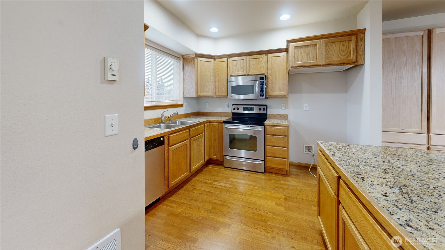 515 Neff Circle Burlington, WA 98233 - Photo 4 of 23 a kitchen with stainless steel appliances granite countertop a stove a sink and a refrigerator