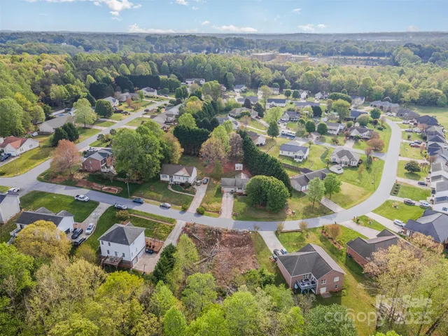 an aerial view of a house with a lake view