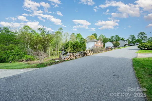 a view of a road with a yard