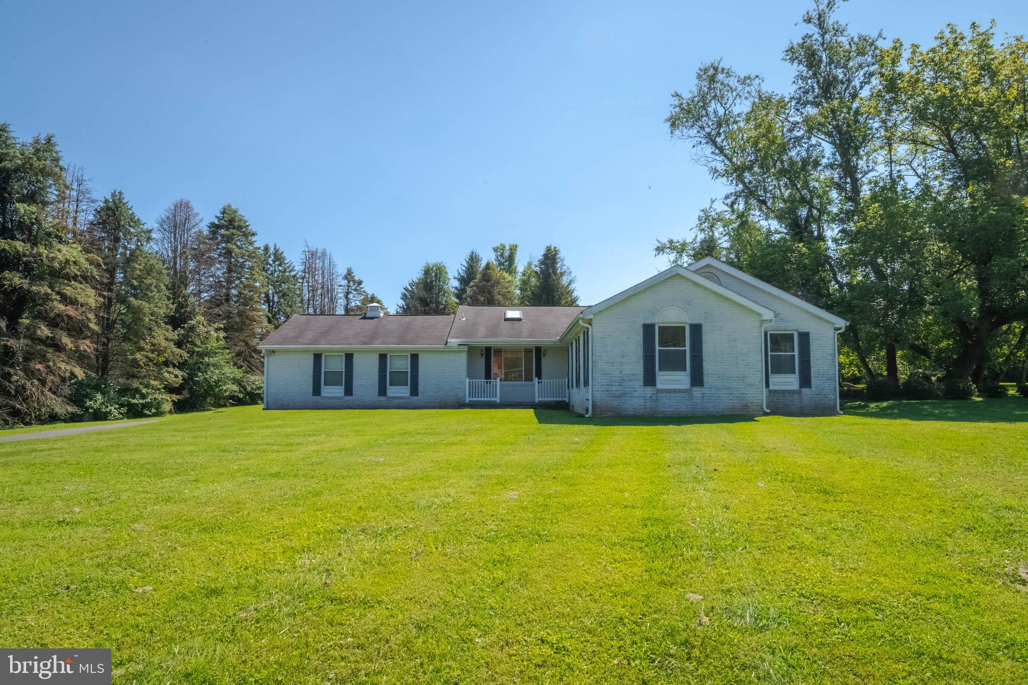 7399 New Cut Road Kingsville, MD 21087 - Photo 1 of 40 a front view of a house with yard and trees