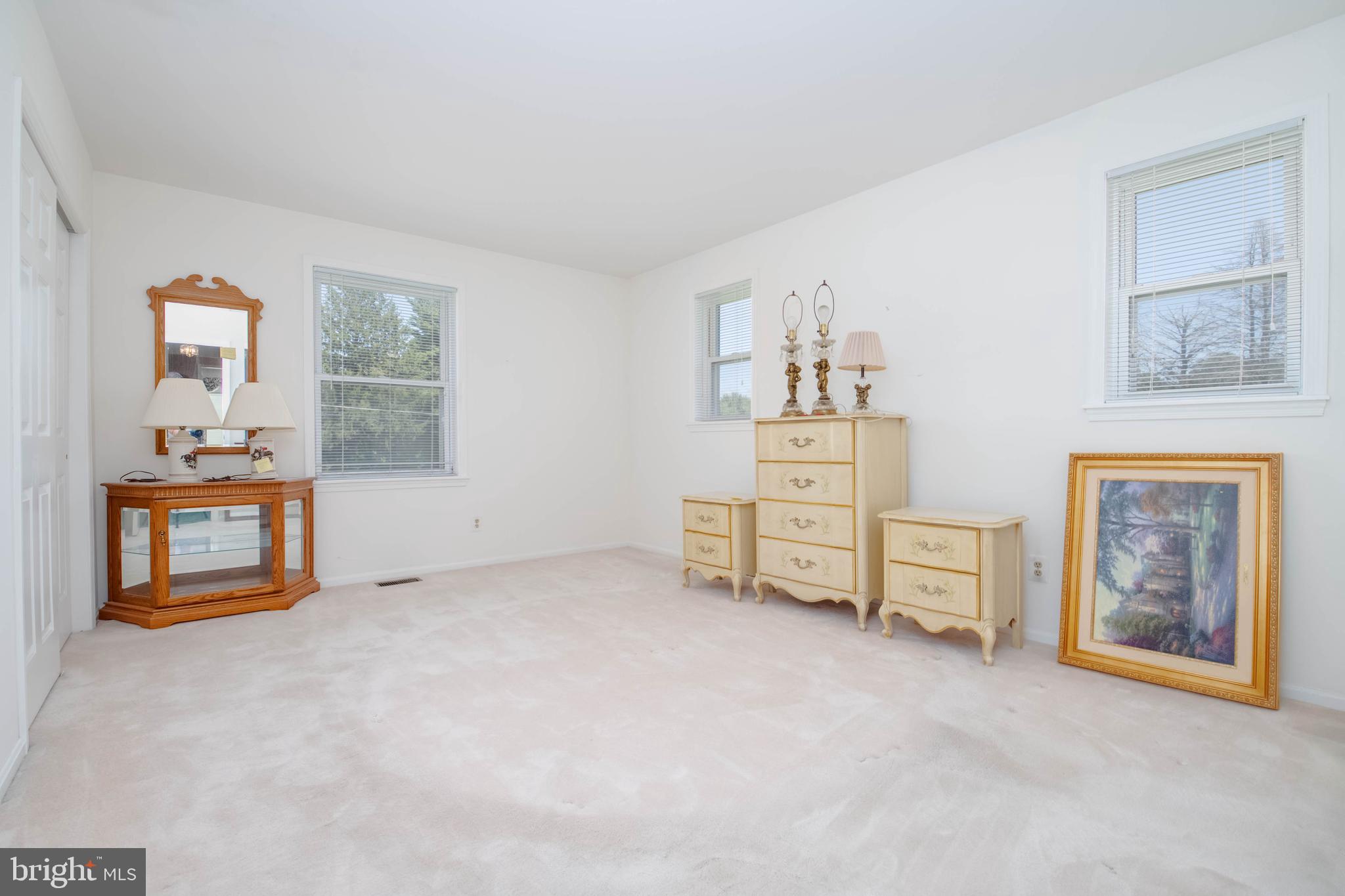 7399 New Cut Road Kingsville, MD 21087 - Photo 21 of 40 an empty room with furniture and natural light