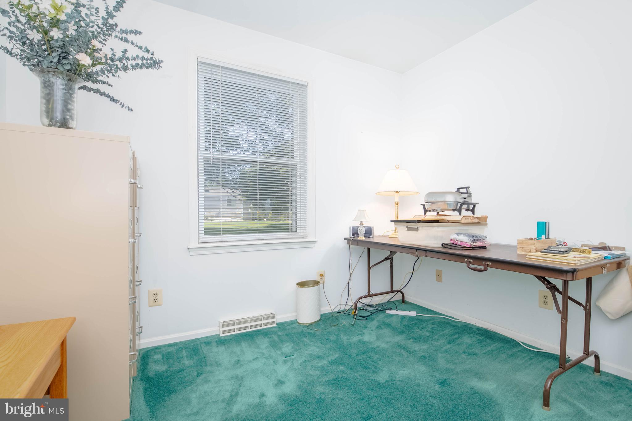 7399 New Cut Road Kingsville, MD 21087 - Photo 31 of 40 a room with a table chairs and a window