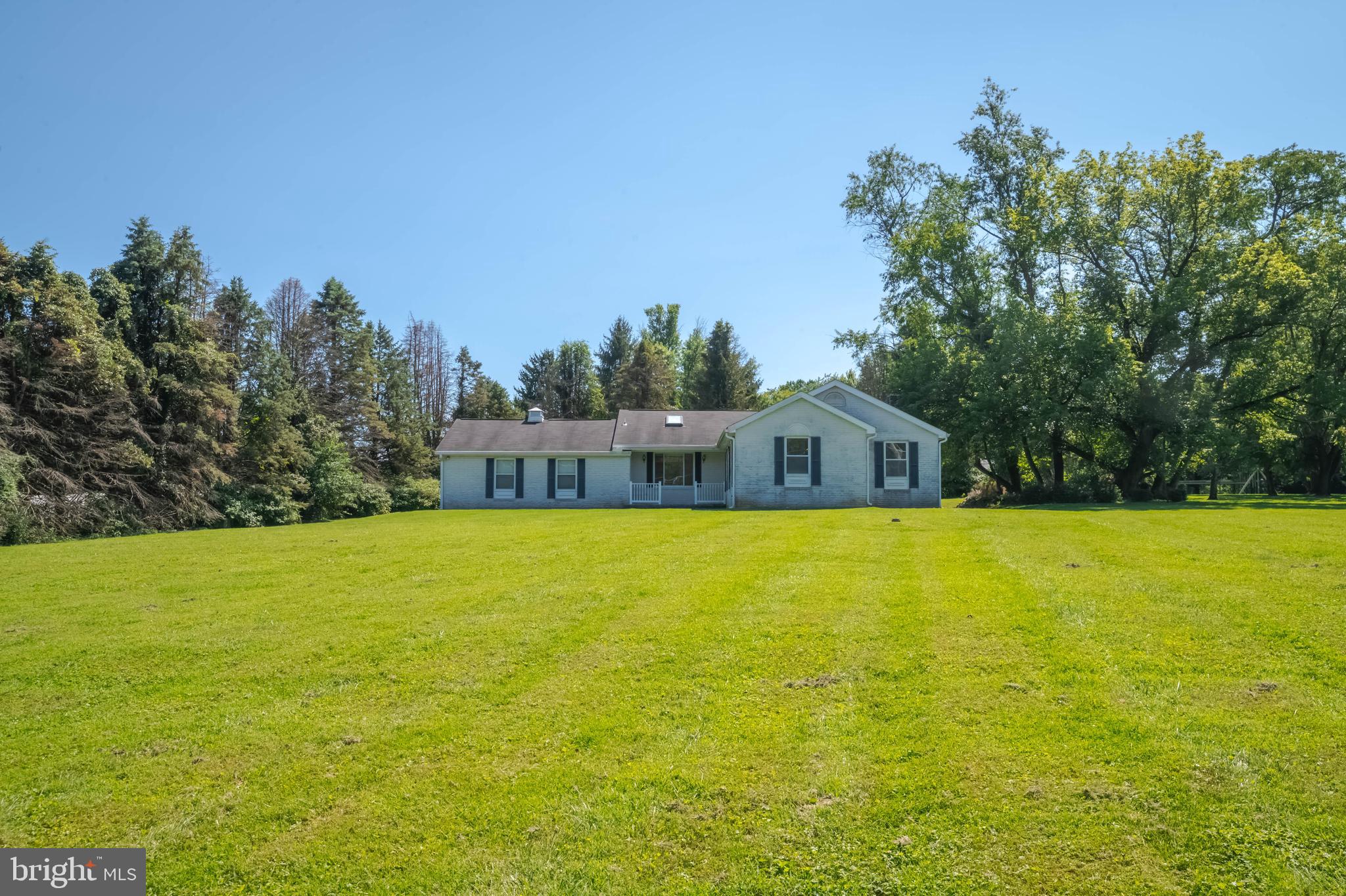 7399 New Cut Road Kingsville, MD 21087 - Photo 4 of 40 a front view of a house with a garden