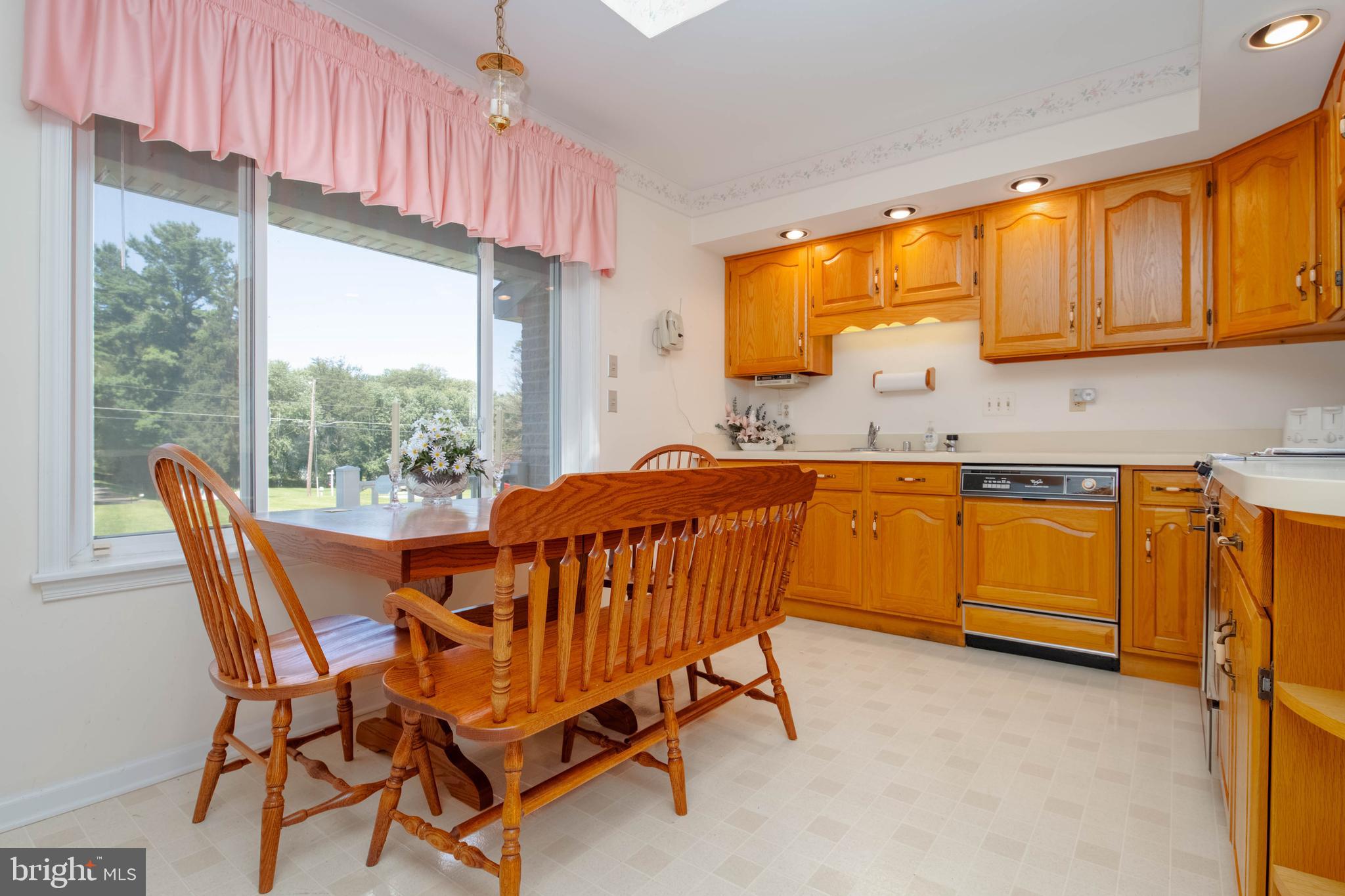 7399 New Cut Road Kingsville, MD 21087 - Photo 10 of 40 a view of a kitchen with a table and chairs