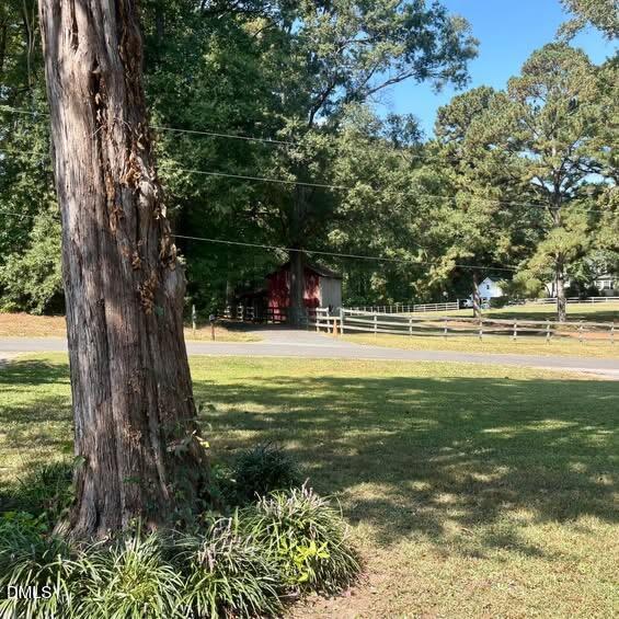 1505 Old Ivey Road Apex, NC 27523 - Photo 2 of 10 a view of a swimming pool and a yard