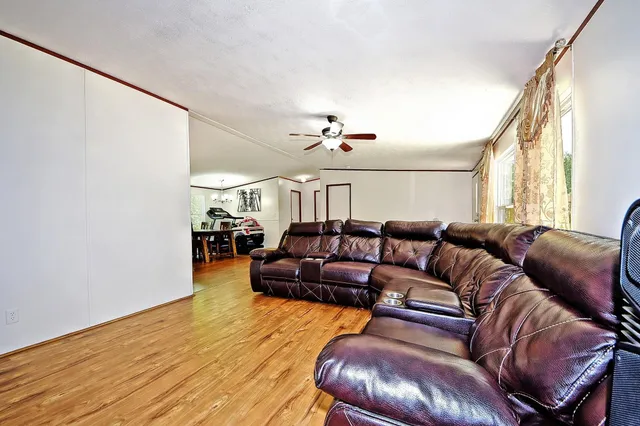 a bedroom with a bed and a potted plant