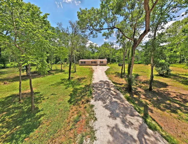 a living room with furniture and flat screen tv