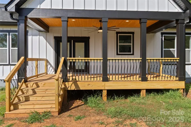 a view of a house with a wooden deck