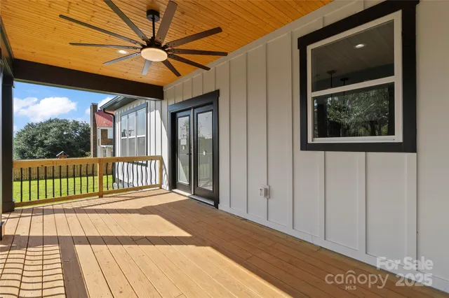 a view of a balcony with a floor to ceiling window