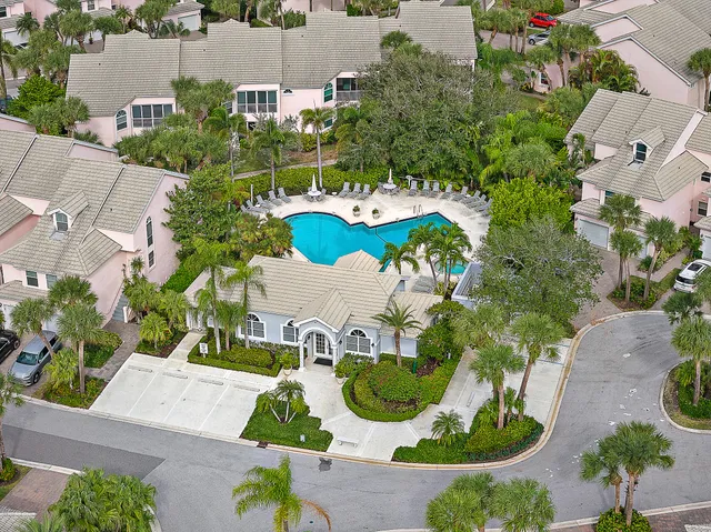 an aerial view of a house with outdoor space