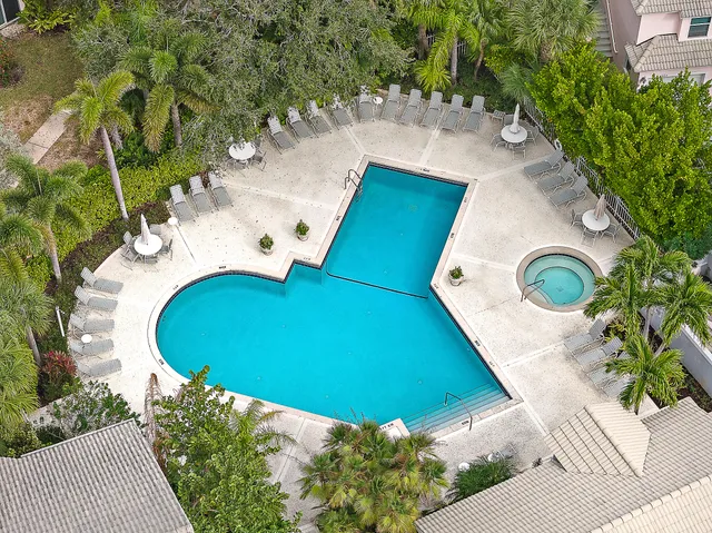a view of a swimming pool with a yard