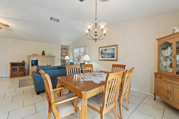 a kitchen with white cabinets stainless steel appliances and a sink