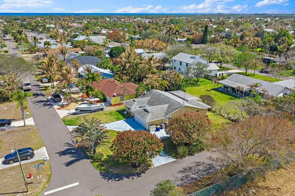 an aerial view of residential houses with outdoor space