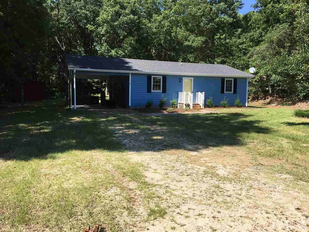 689 Silas Moore Road Coats, NC 27521 - Photo 1 of 17 a front view of a house with a yard