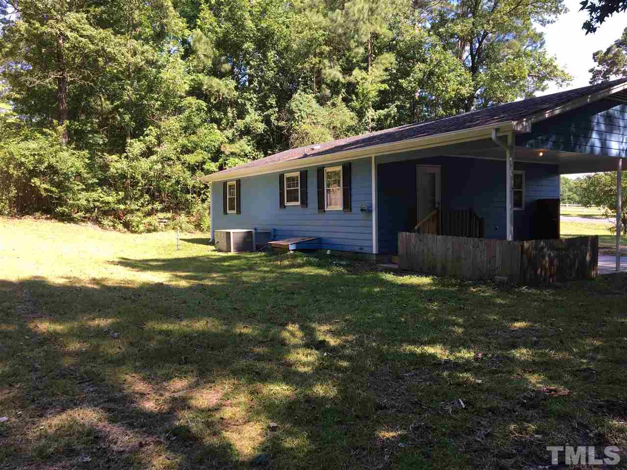 689 Silas Moore Road Coats, NC 27521 - Photo 13 of 17 a view of house with backyard