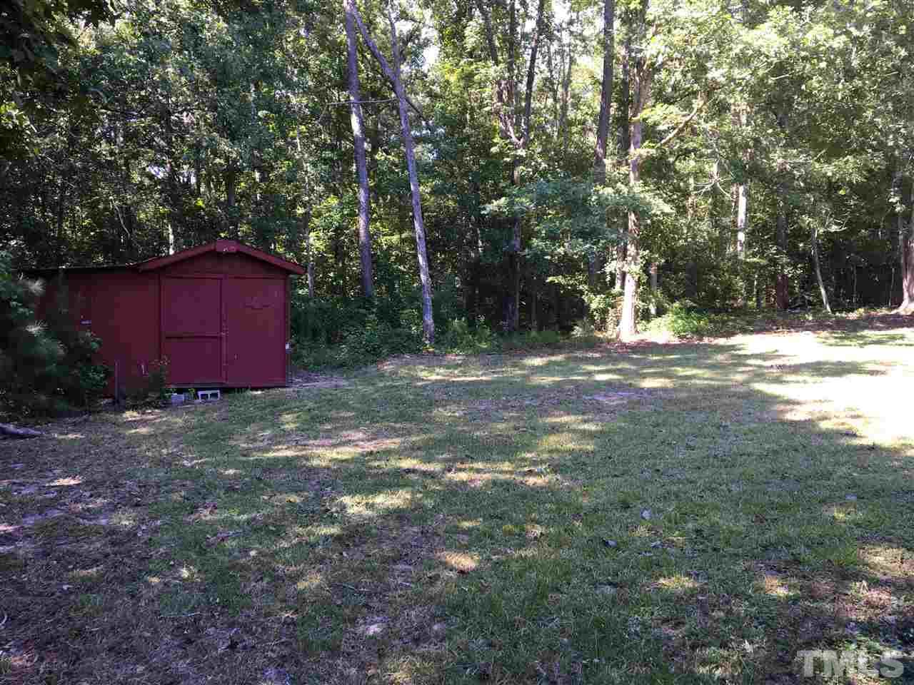 689 Silas Moore Road Coats, NC 27521 - Photo 14 of 17 a fire hydrant in the middle of a field