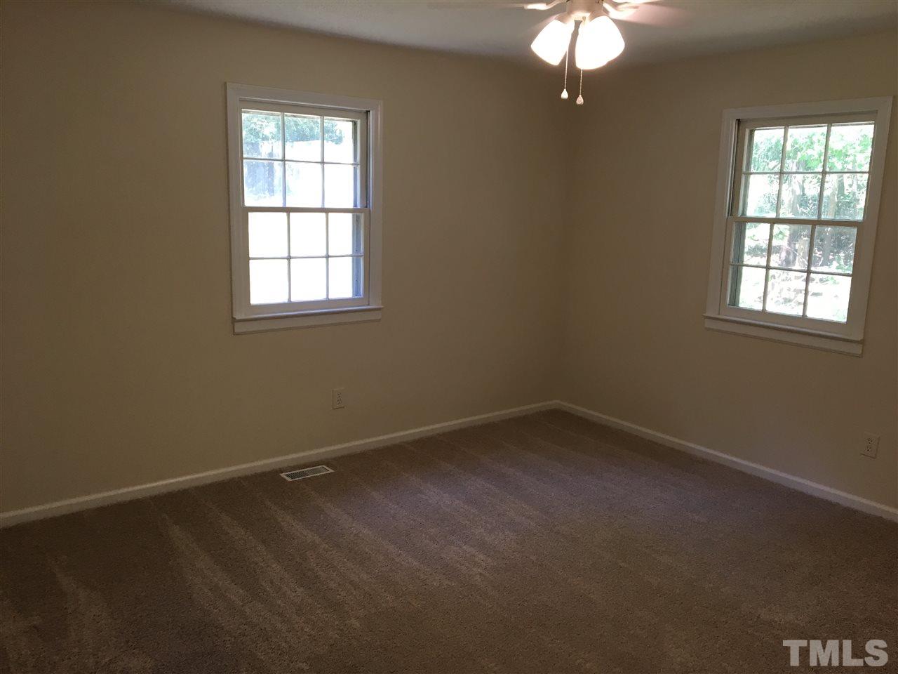 689 Silas Moore Road Coats, NC 27521 - Photo 9 of 17 an empty room with a window