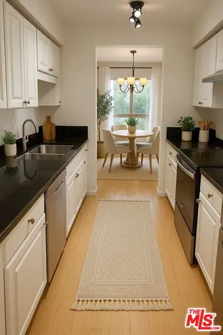 a kitchen with granite countertop lots of counter top space and dining table