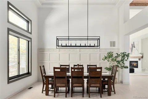 a view of a dining room with furniture and window