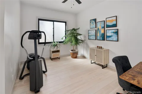 a bedroom with furniture and a window