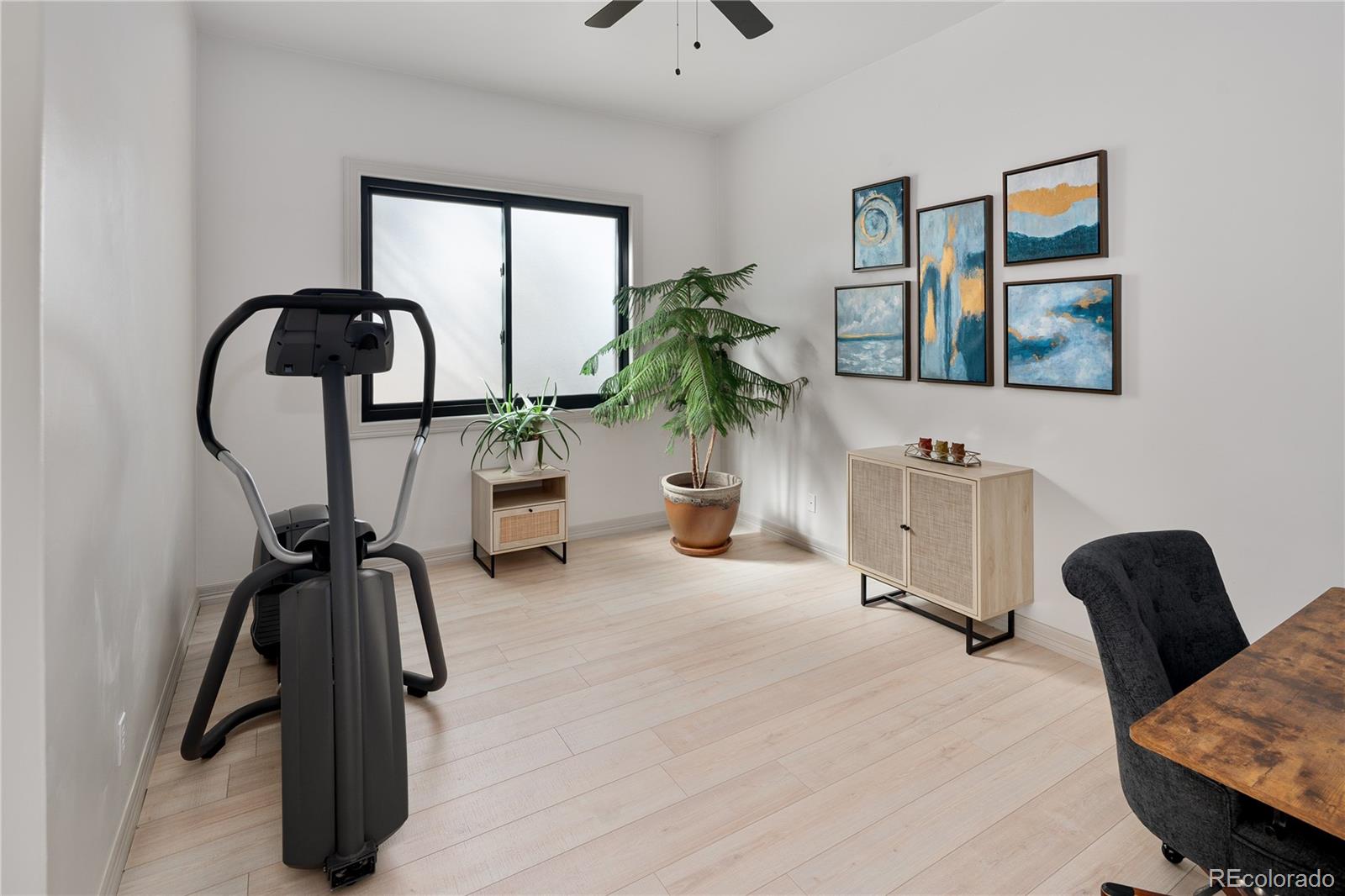 20132 East Shady Ridge Road Parker, CO 80134 - Photo 18 of 50 a bedroom with furniture and a window