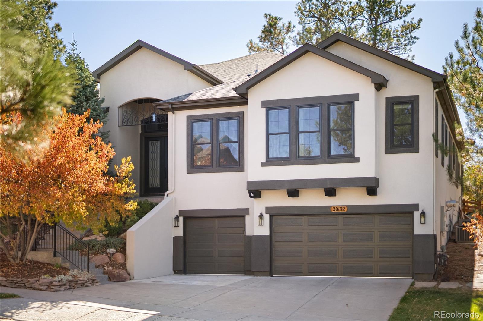 20132 East Shady Ridge Road Parker, CO 80134 - Photo 2 of 50 a front view of a house with a yard