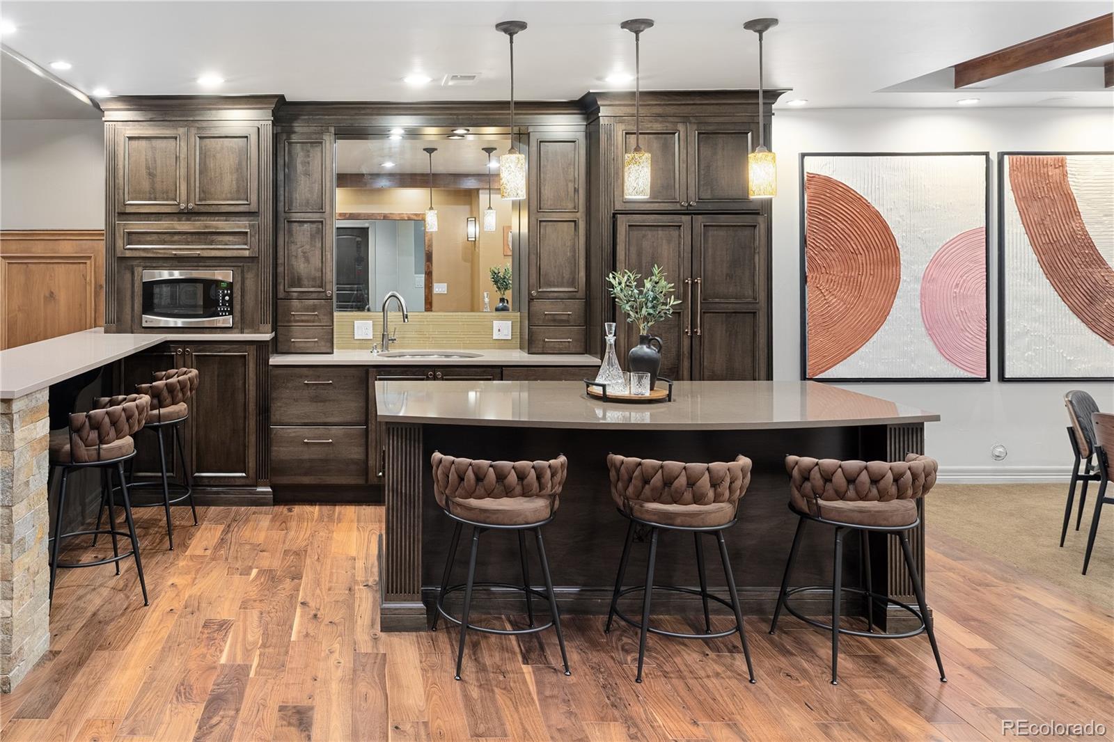 20132 East Shady Ridge Road Parker, CO 80134 - Photo 29 of 50 a kitchen with granite countertop a stove a sink and a refrigerator