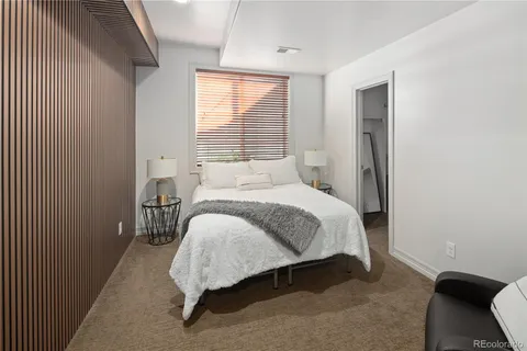 a bed room with a bed and a window