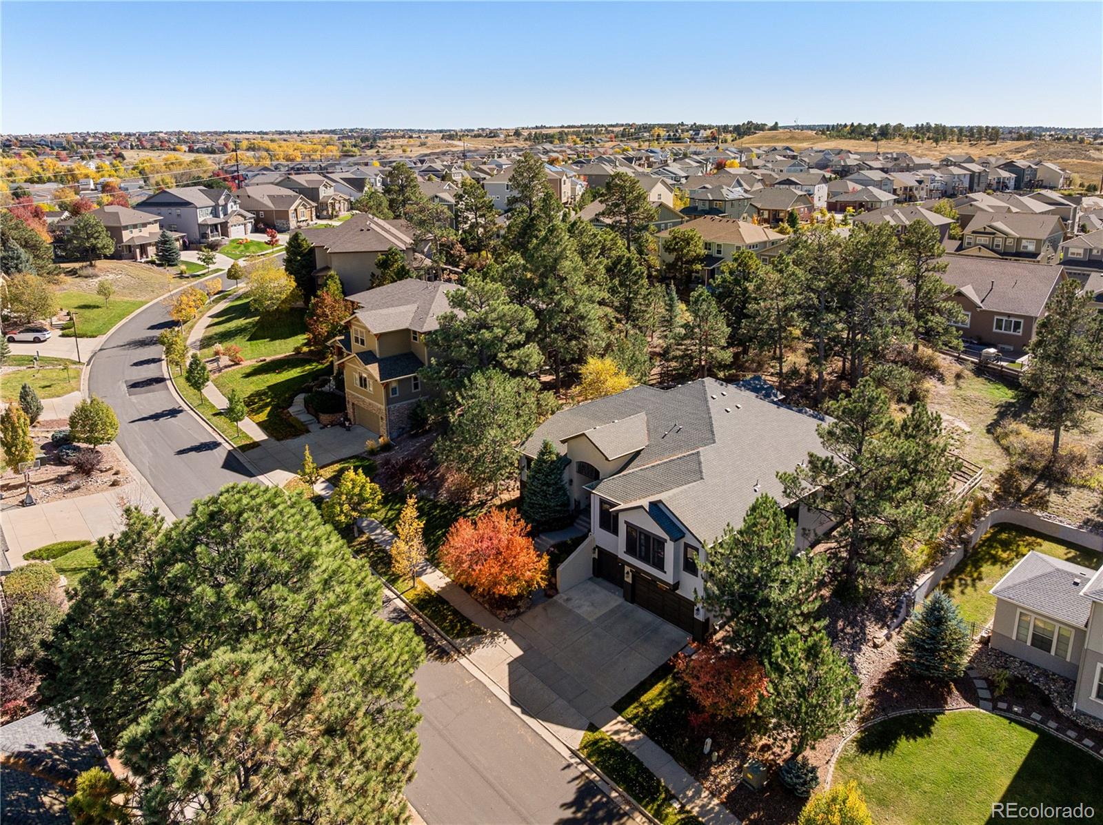 20132 East Shady Ridge Road Parker, CO 80134 - Photo 42 of 50 an aerial view of multiple houses with yard