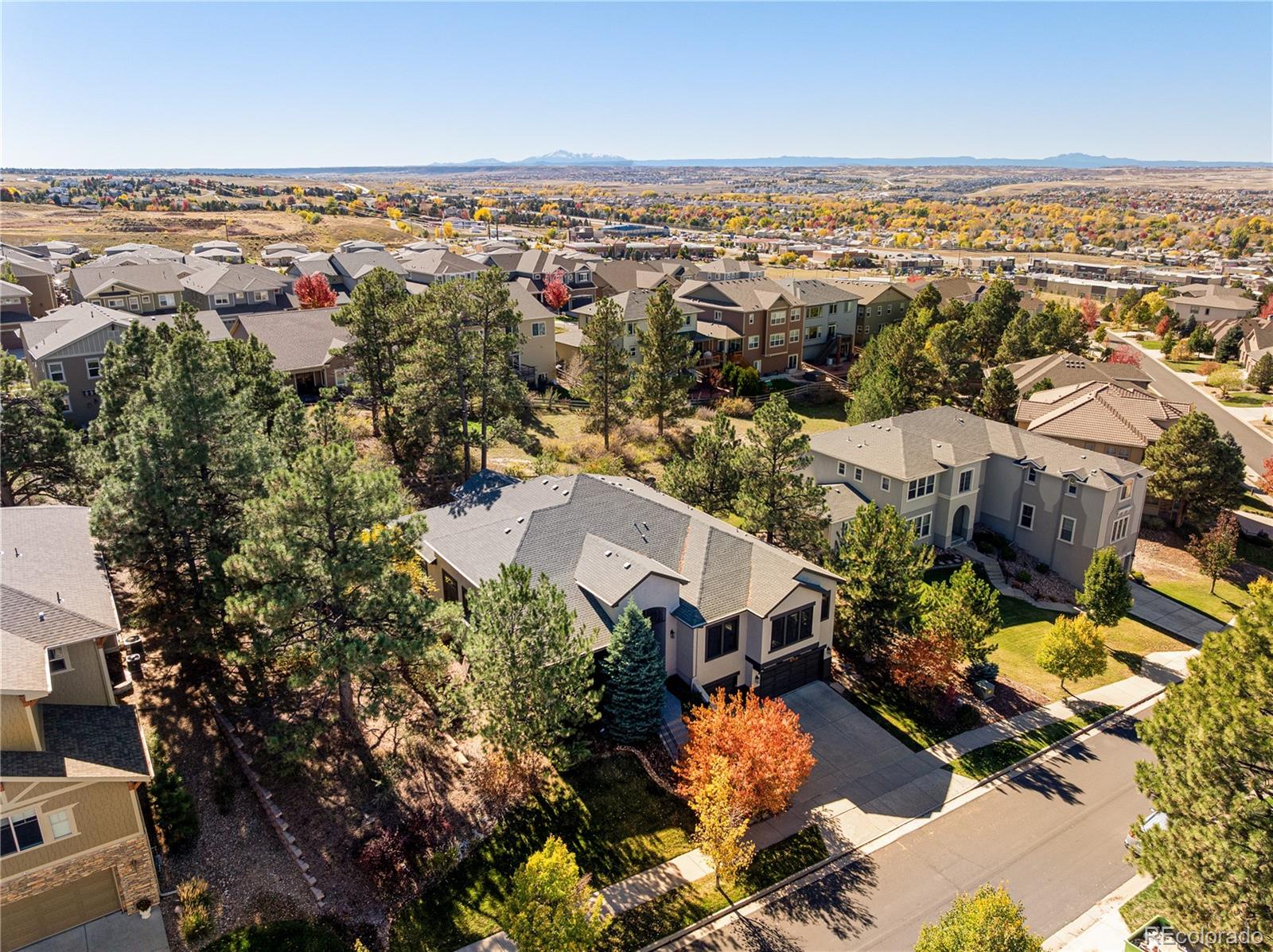 20132 East Shady Ridge Road Parker, CO 80134 - Photo 43 of 50 an aerial view of a house with a lake view