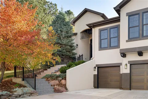 a view of a house with a tree