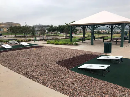 a view of swimming pool with outdoor seating and a yard