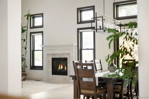 a living room with furniture a window and fireplace