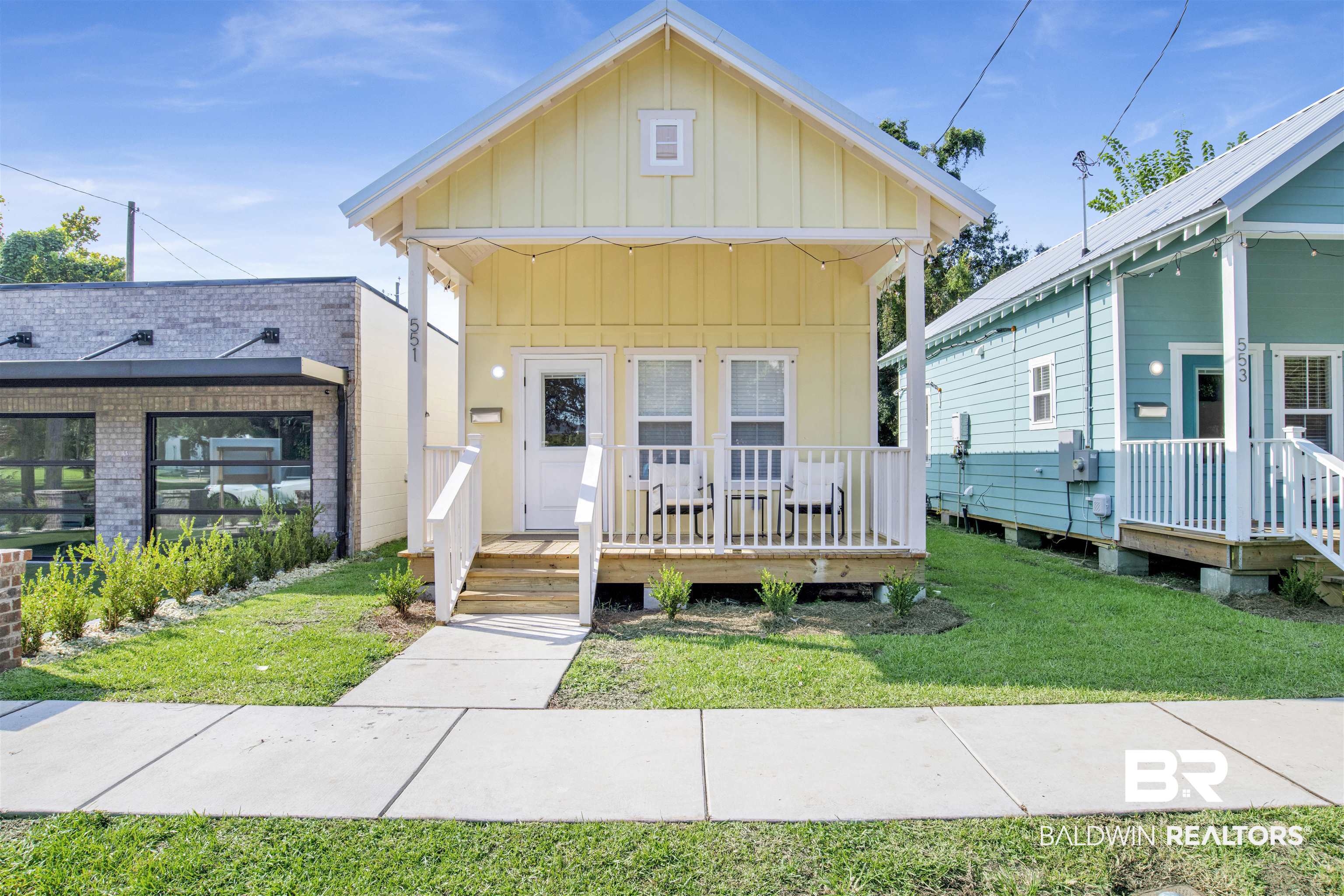 551 Congress Street Mobile, AL 36603 - Photo 2 of 19 View of front of property with board and batten siding, a front yard, and a porch