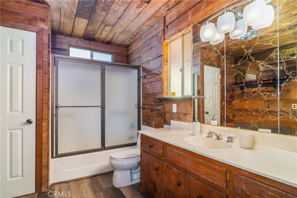 61191 Wilson Terrace Joshua Tree, CA 92252 - Photo 11 of 29 a bathroom with a double vanity sink toilet and shower
