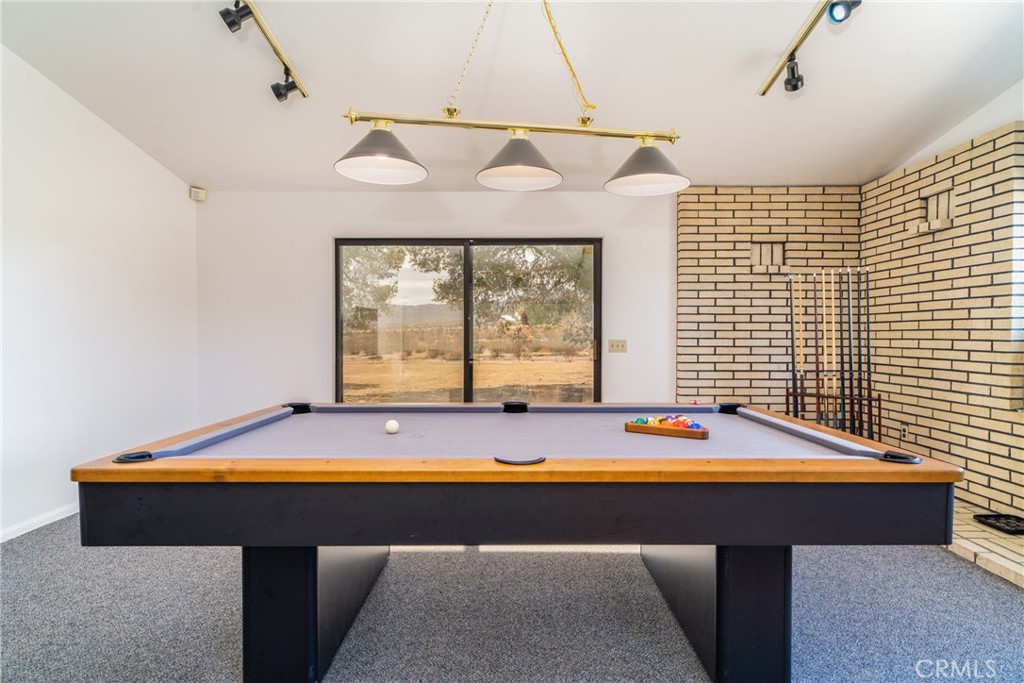 61191 Wilson Terrace Joshua Tree, CA 92252 - Photo 21 of 29 a room with pool table and windows