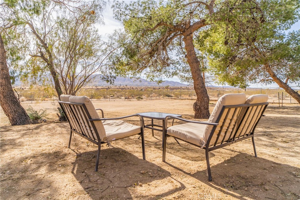 61191 Wilson Terrace Joshua Tree, CA 92252 - Photo 28 of 29 a view of a chairs and table on the terrace