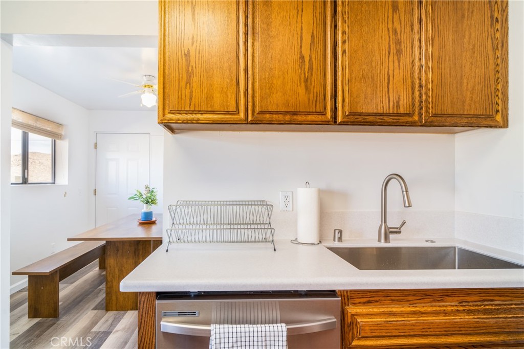 61191 Wilson Terrace Joshua Tree, CA 92252 - Photo 5 of 29 a kitchen with a sink and cabinets