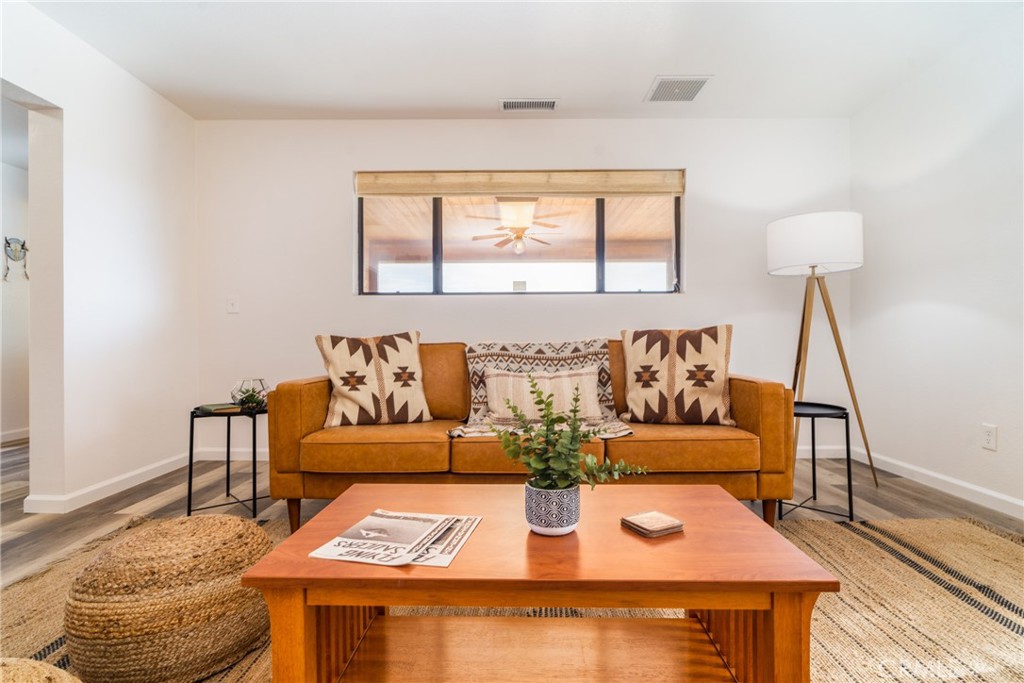 61191 Wilson Terrace Joshua Tree, CA 92252 - Photo 9 of 29 a living room with furniture and a window