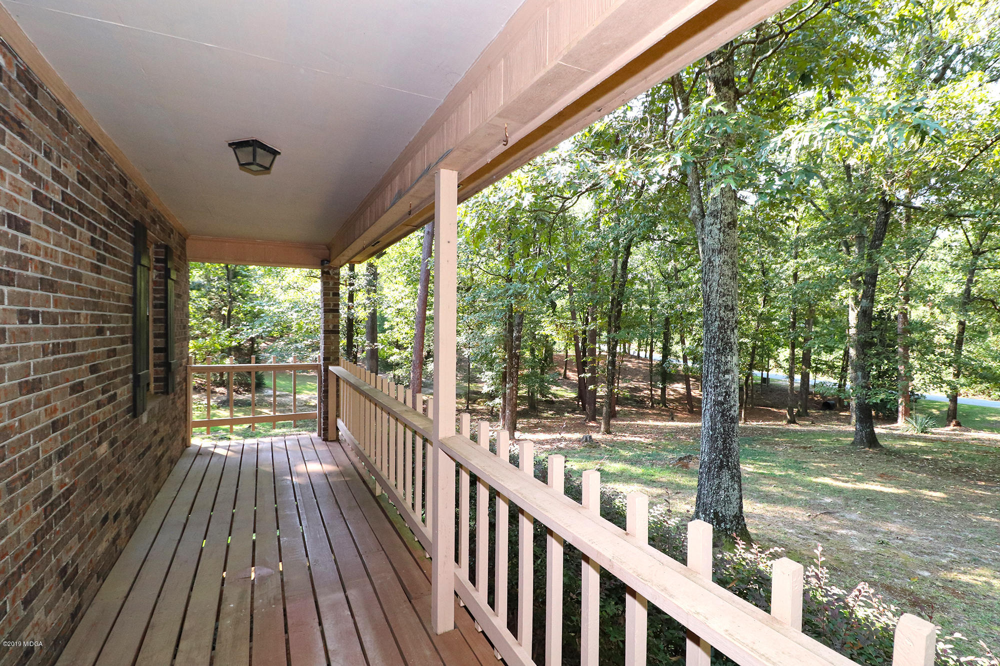 231 Red Oak Road Byron, GA 31008 - Photo 3 of 42 a view of a porch with wooden floor and outdoor space